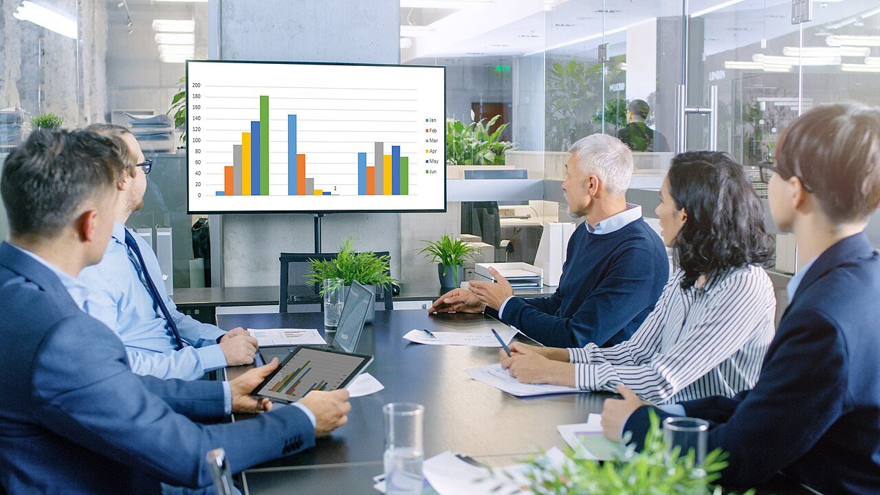 Departments comparing numbers in a meeting